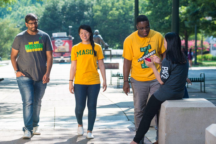 INTO Mason students wearing Mason shirts tour the Fairfax Campus
